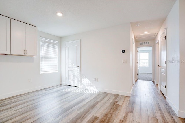 unfurnished room with light hardwood / wood-style flooring