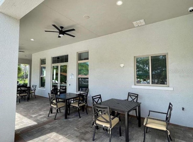 view of patio featuring ceiling fan