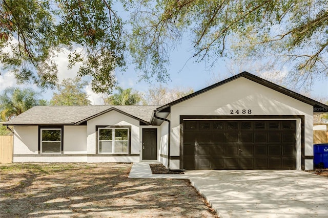 single story home featuring a garage