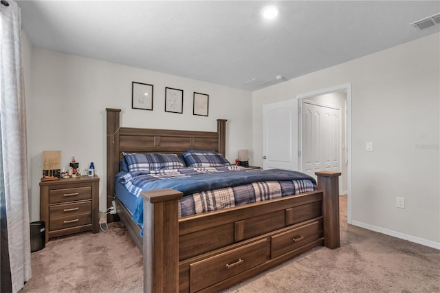 bedroom featuring light colored carpet