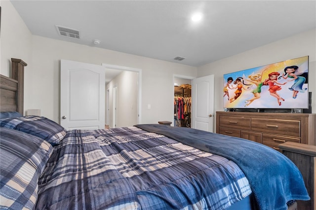 bedroom with a walk in closet