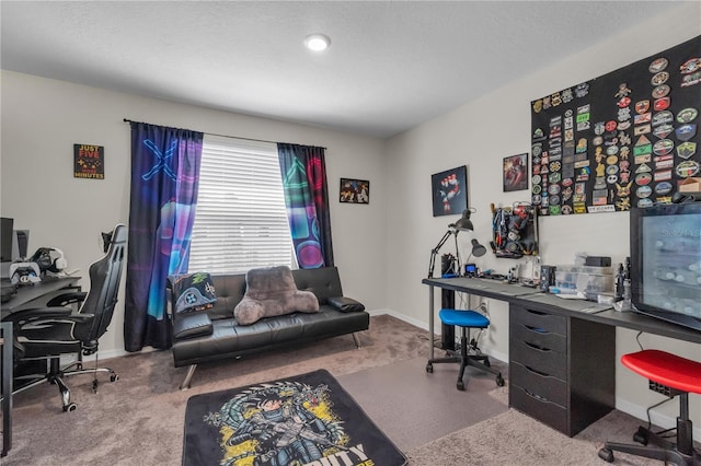 carpeted office featuring a textured ceiling