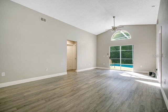 unfurnished room with hardwood / wood-style flooring, a textured ceiling, and ceiling fan