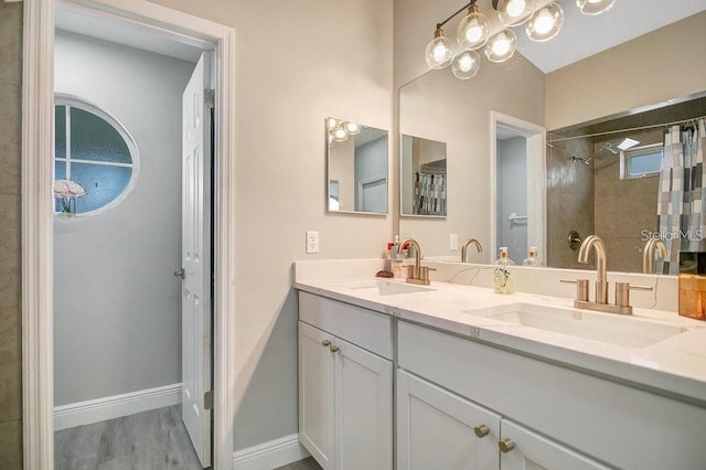 bathroom featuring vanity and a shower with shower curtain