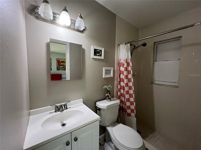 bathroom featuring vanity, toilet, and a shower with shower curtain