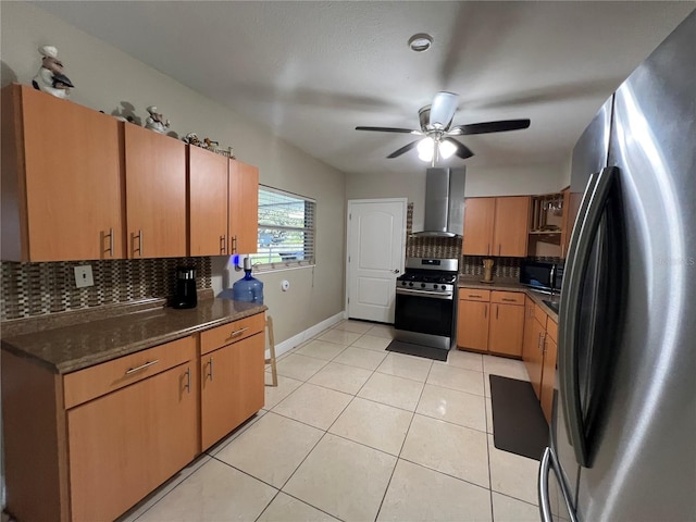 kitchen with wall chimney exhaust hood, stainless steel appliances, backsplash, and light tile patterned floors