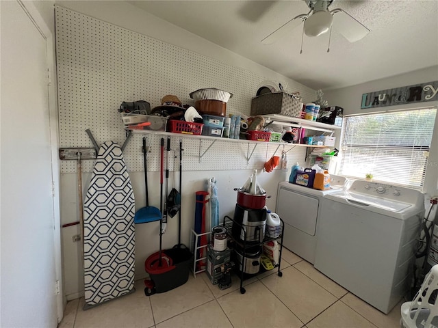 laundry room featuring washing machine and dryer, light tile patterned floors, and ceiling fan