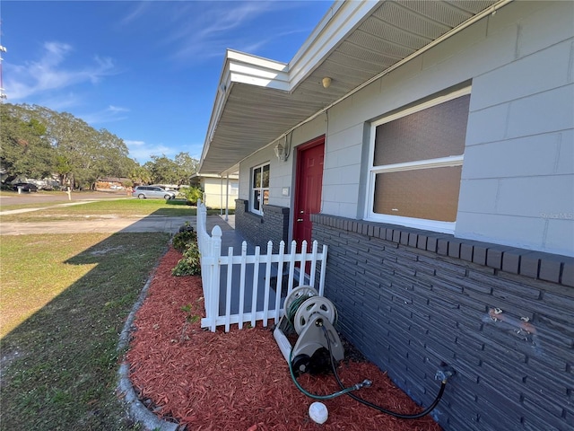 view of side of property with a yard