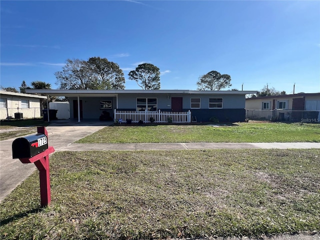 view of front of house featuring a front yard and a carport