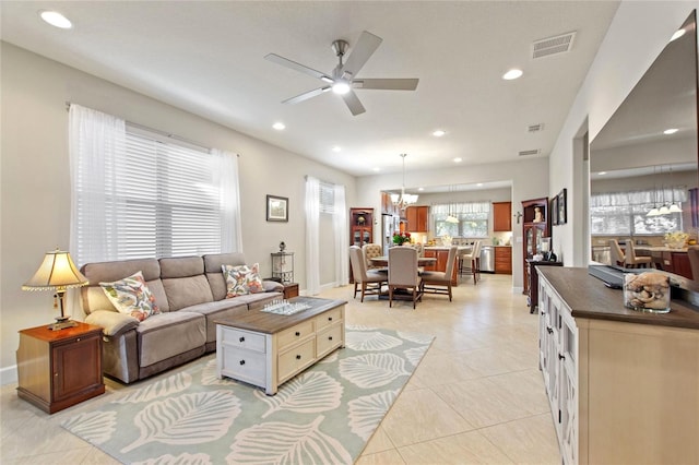 living room featuring recessed lighting, visible vents, baseboards, ceiling fan, and light tile patterned flooring