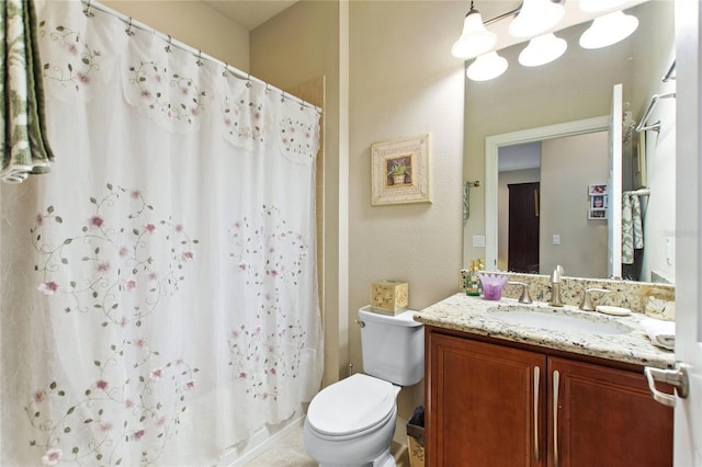 bathroom with toilet, a shower with shower curtain, and vanity