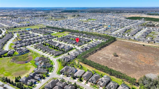 birds eye view of property with a residential view