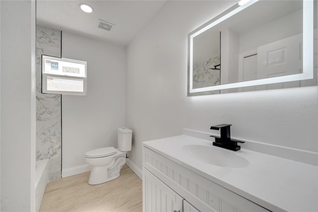 full bathroom featuring vanity, toilet, and shower / washtub combination