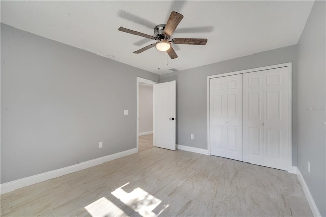 unfurnished bedroom featuring a closet and ceiling fan