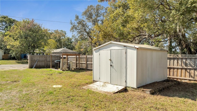 view of outbuilding featuring a lawn