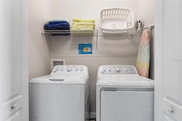 clothes washing area featuring laundry area and washing machine and clothes dryer