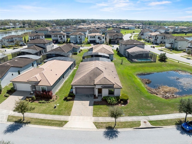 aerial view with a residential view and a water view