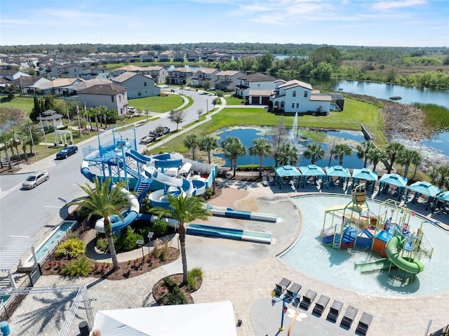 aerial view with a residential view and a water view