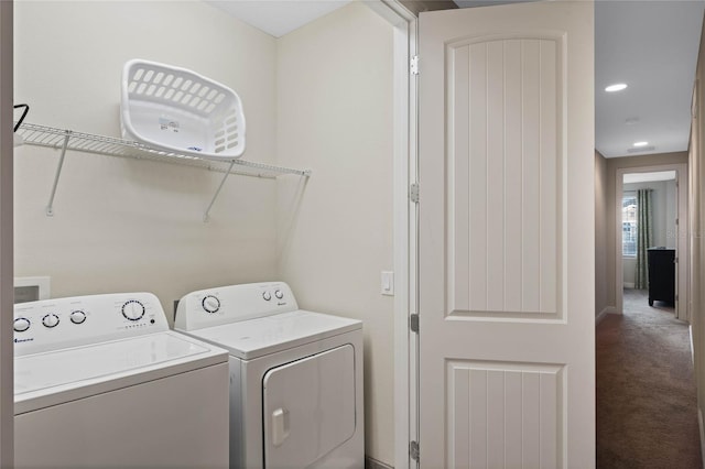 laundry area featuring washing machine and clothes dryer and carpet flooring