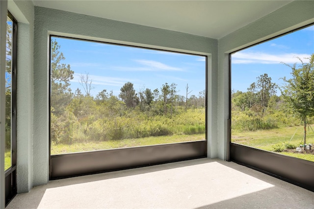 139 Aces High Ln, Davenport, FL 33896 - unfurnished sunroom featuring plenty of natural light and a textured wall
