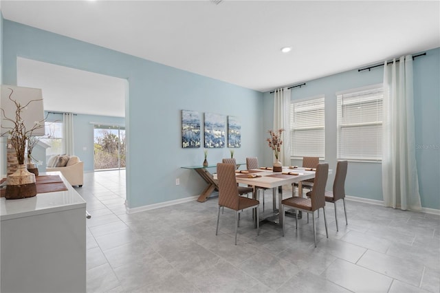 139 Aces High Ln, Davenport, FL 33896 - dining room featuring light tile patterned flooring, baseboards, and recessed lighting