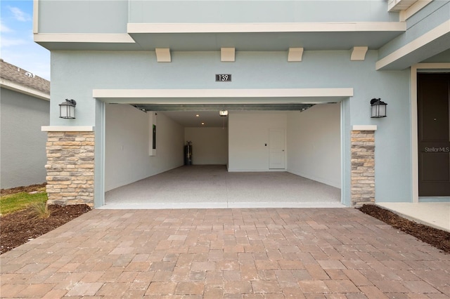 139 Aces High Ln, Davenport, FL 33896 - garage featuring decorative driveway