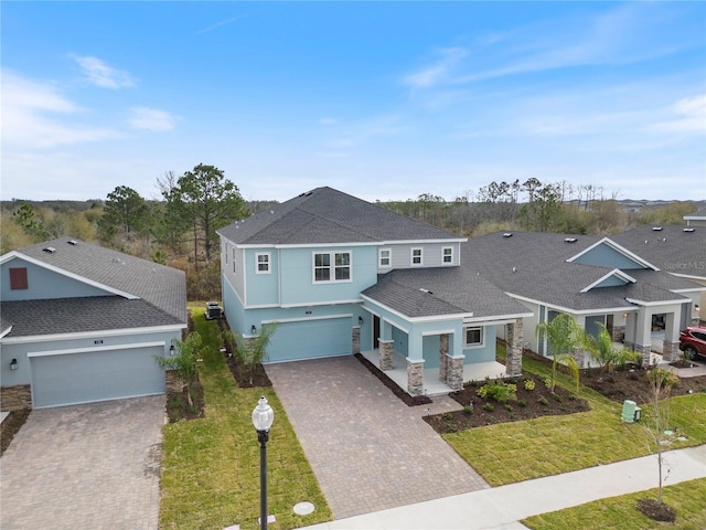 139 Aces High Ln, Davenport, FL 33896 - exterior space with stone siding, stucco siding, and decorative driveway