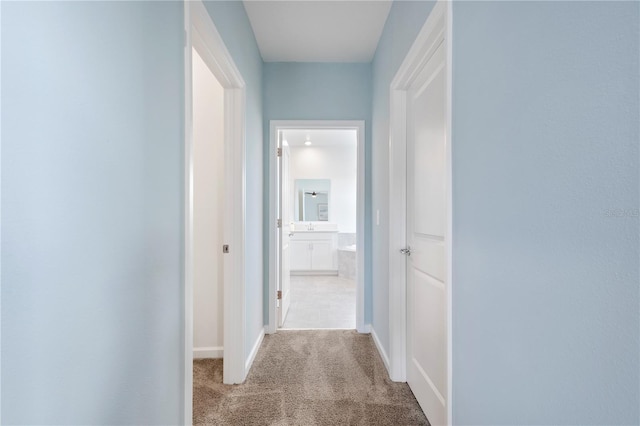 139 Aces High Ln, Davenport, FL 33896 - hallway with baseboards and carpet