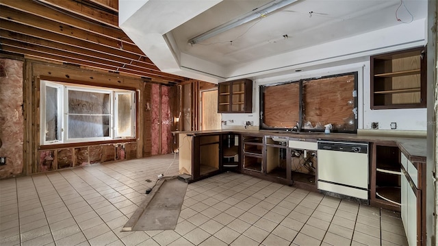kitchen featuring light tile patterned floors, sink, and dishwasher