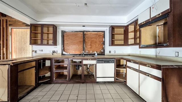 kitchen featuring dark brown cabinetry, sink, dishwasher, and light tile patterned flooring