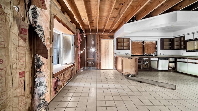 kitchen with light tile patterned floors and wooden ceiling