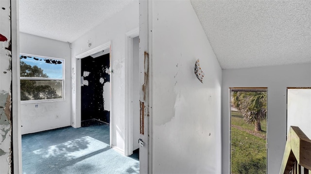 hallway featuring a textured ceiling