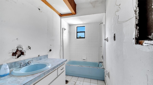bathroom featuring vanity and tiled shower / bath combo