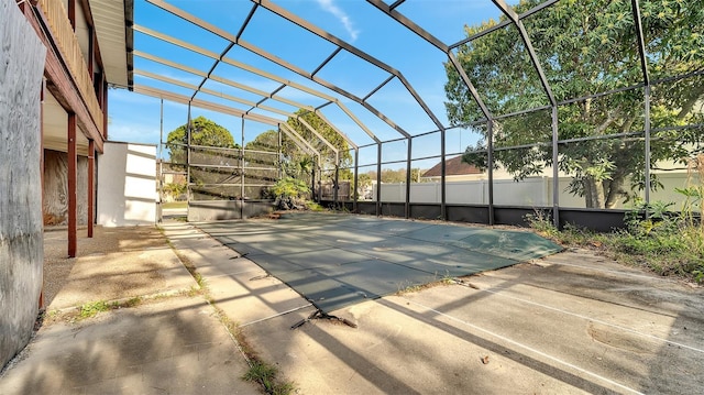 view of pool with a lanai and a patio