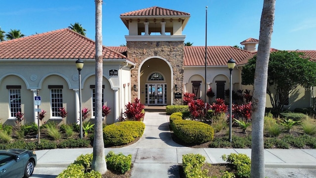 mediterranean / spanish-style house with french doors