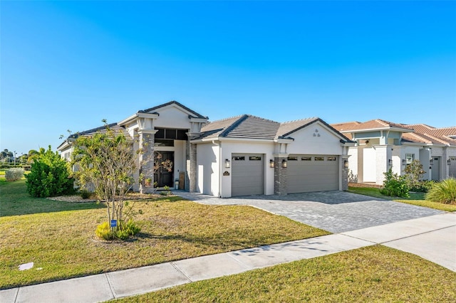 view of front of home with a garage and a front yard