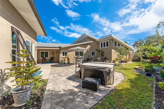 view of patio / terrace featuring a hot tub