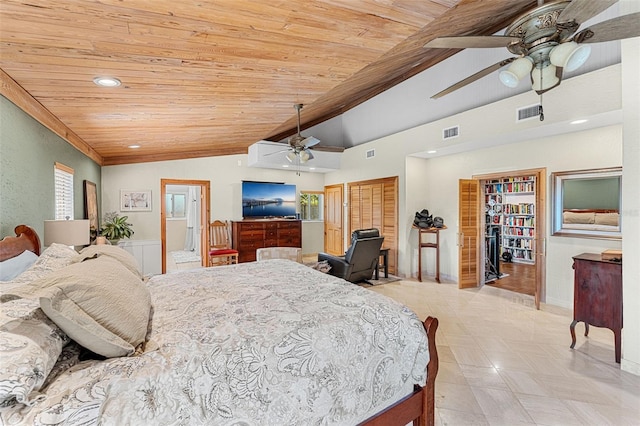 bedroom with light tile patterned floors, wood ceiling, ceiling fan, ensuite bathroom, and vaulted ceiling