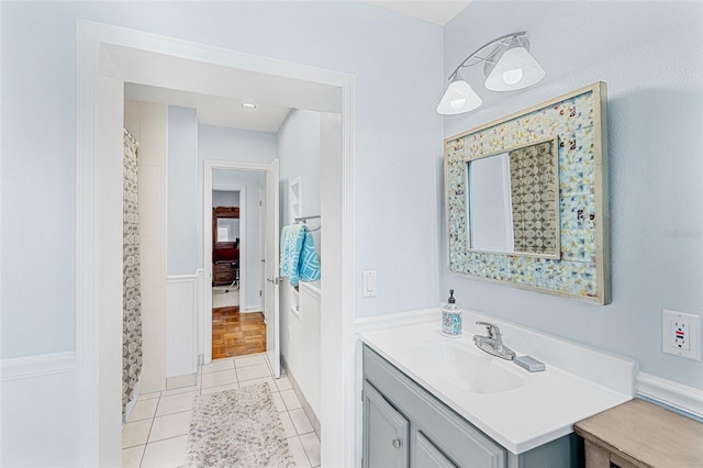 bathroom with tile patterned floors and vanity