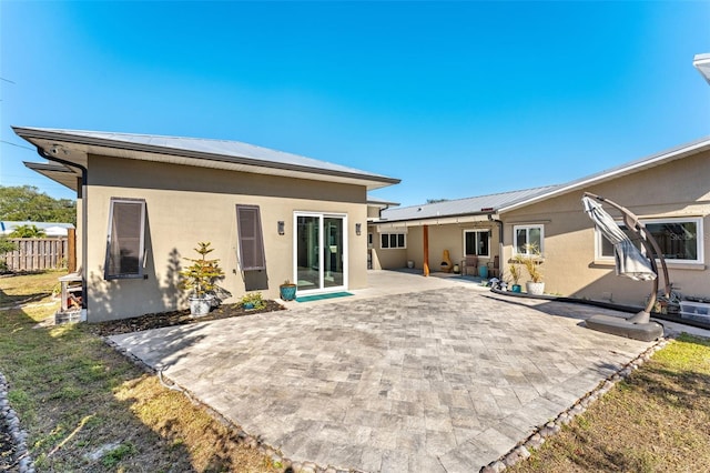 rear view of house with a patio area