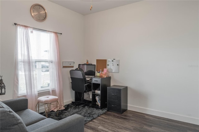 home office with dark wood-type flooring