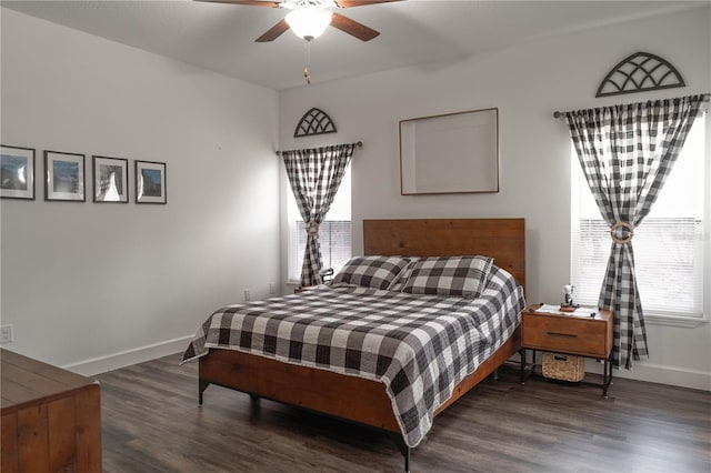 bedroom with ceiling fan and dark hardwood / wood-style floors