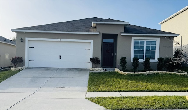 ranch-style house featuring a garage and a front yard