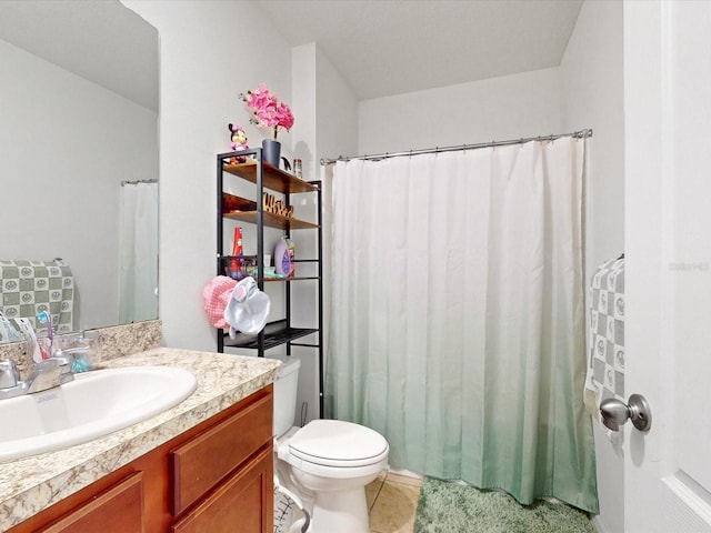 full bathroom with toilet, tile patterned floors, and vanity