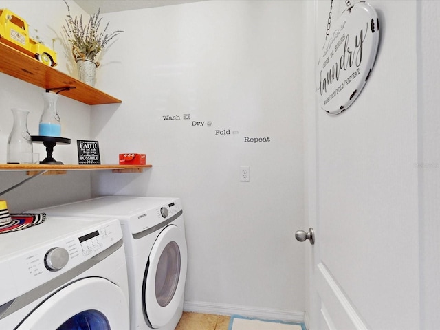 laundry room featuring laundry area, washer and clothes dryer, and baseboards