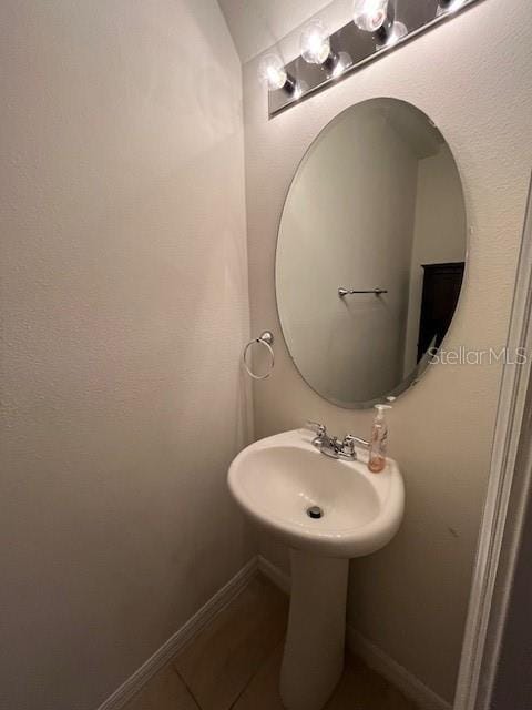 bathroom featuring tile patterned flooring and sink