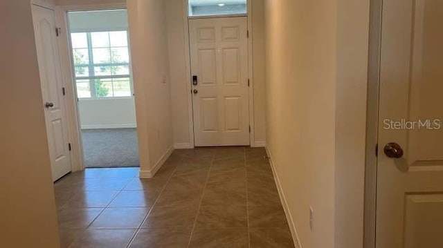 interior space with tile patterned floors