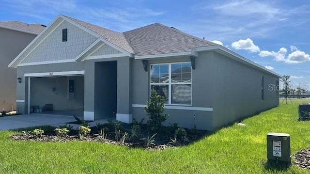 exterior space with a garage and a front lawn