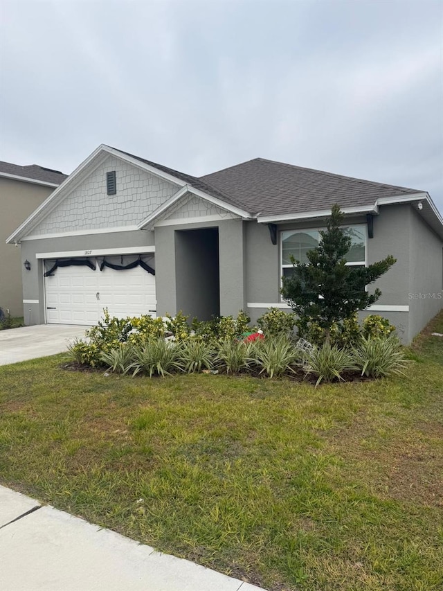 1827 Silverbell Loop, Haines City, FL 33844 - view of front of house with an attached garage, a front yard, concrete driveway, and a shingled roof