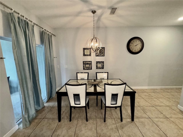 dining area with an inviting chandelier and light tile patterned floors